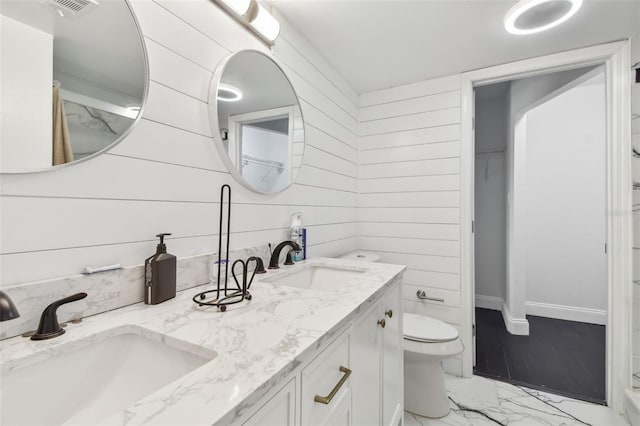 345 S Mcmullen Booth Rd Unit 142, Clearwater, FL 33759 - bathroom featuring marble look tiles and double vanity