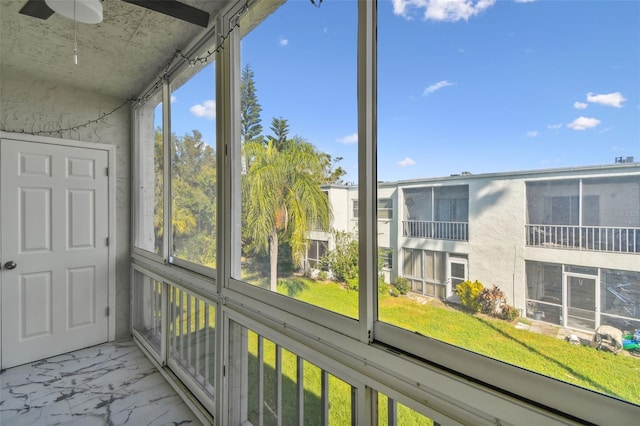 345 S Mcmullen Booth Rd Unit 142, Clearwater, FL 33759 - unfurnished sunroom featuring ceiling fan