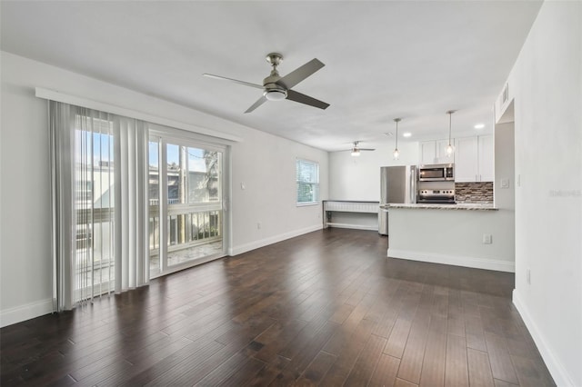 345 S Mcmullen Booth Rd Unit 142, Clearwater, FL 33759 - unfurnished living room featuring a ceiling fan and dark wood finished floors