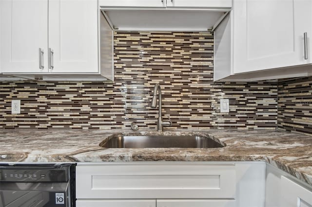 345 S Mcmullen Booth Rd Unit 142, Clearwater, FL 33759 - kitchen with white cabinets, dishwasher, and backsplash