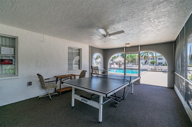 345 S Mcmullen Booth Rd Unit 142, Clearwater, FL 33759 - playroom with a textured wall, ceiling fan, carpet, and a textured ceiling