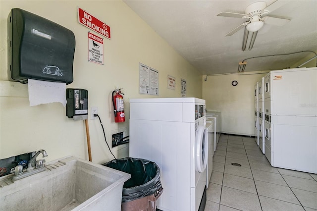 345 S Mcmullen Booth Rd Unit 142, Clearwater, FL 33759 - community laundry room with stacked washer / dryer, washing machine and clothes dryer, ceiling fan, and light tile patterned flooring