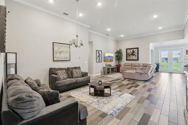 12004 Cinnamon Fern Dr, Riverview, FL 33579 - living room with arched walkways, recessed lighting, wood finished floors, a chandelier, and ornamental molding