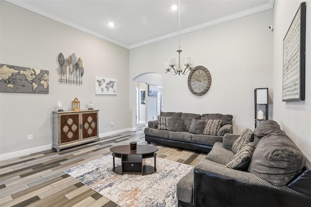 12004 Cinnamon Fern Dr, Riverview, FL 33579 - living room featuring arched walkways, ornamental molding, a chandelier, wood finished floors, and recessed lighting
