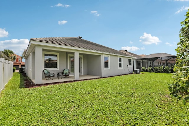 12004 Cinnamon Fern Dr, Riverview, FL 33579 - back of property with stucco siding, a patio area, and a tile roof