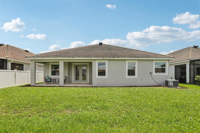 12004 Cinnamon Fern Dr, Riverview, FL 33579 - rear view of property featuring stucco siding and french doors
