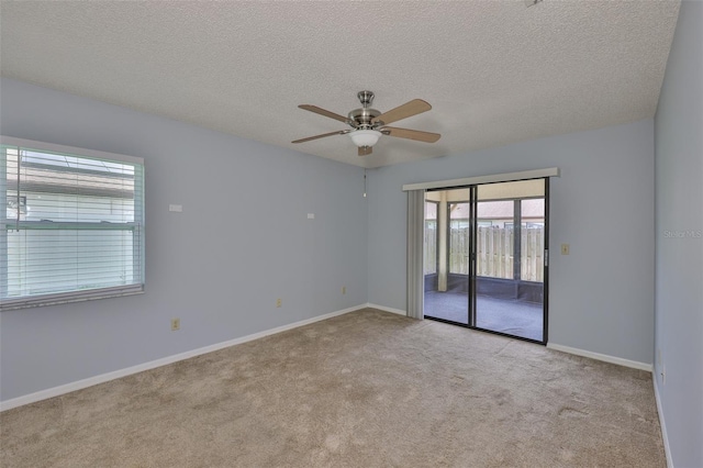 1717 Atrium Dr, Sun City Center, FL 33573 - spare room with ceiling fan, carpet floors, and a textured ceiling
