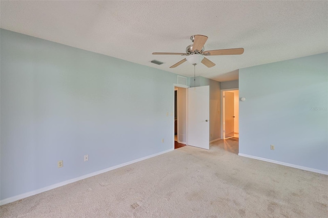 1717 Atrium Dr, Sun City Center, FL 33573 - carpeted empty room with a ceiling fan and a textured ceiling