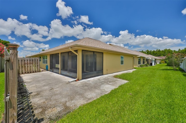 1717 Atrium Dr, Sun City Center, FL 33573 - back of property with a sunroom, a patio, and stucco siding