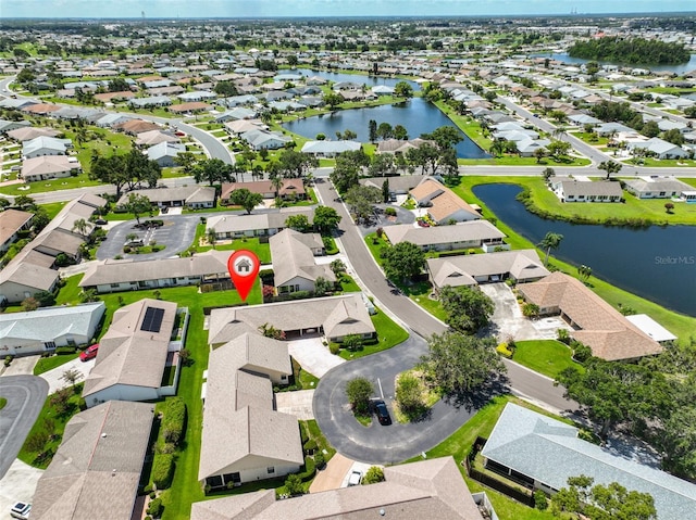 1717 Atrium Dr, Sun City Center, FL 33573 - aerial view of residential area with a nearby body of water