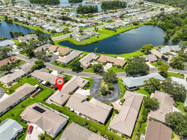 1717 Atrium Dr, Sun City Center, FL 33573 - aerial perspective of suburban area featuring a nearby body of water