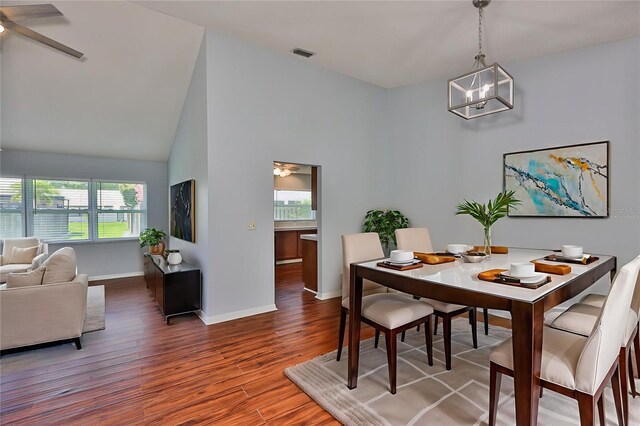 1717 Atrium Dr, Sun City Center, FL 33573 - dining space with wood finished floors, ceiling fan, and a chandelier