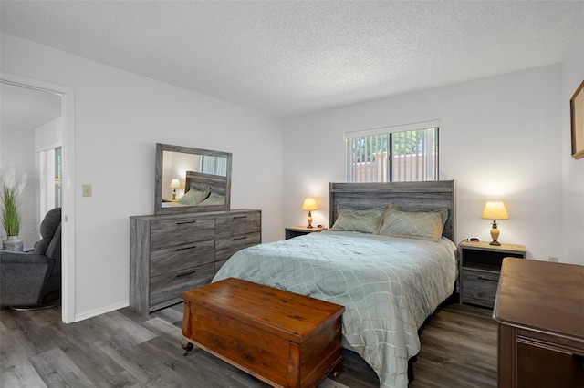 7433 Greystone Dr Unit 7433, Hudson, FL 34667 - bedroom featuring dark wood-style flooring and a textured ceiling