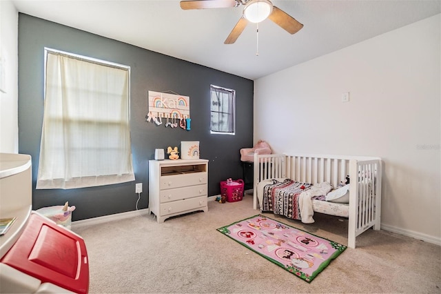 2073 Branding Iron Way, New Port Richey, FL 34655 - bedroom with carpet floors, a nursery area, and ceiling fan