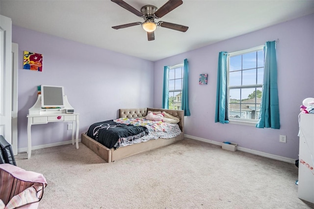 2073 Branding Iron Way, New Port Richey, FL 34655 - carpeted bedroom with baseboards and a ceiling fan
