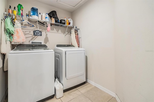 2073 Branding Iron Way, New Port Richey, FL 34655 - laundry room with washer and clothes dryer and light tile patterned floors