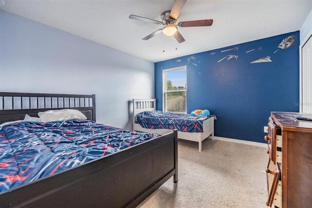 2073 Branding Iron Way, New Port Richey, FL 34655 - carpeted bedroom with a ceiling fan and baseboards