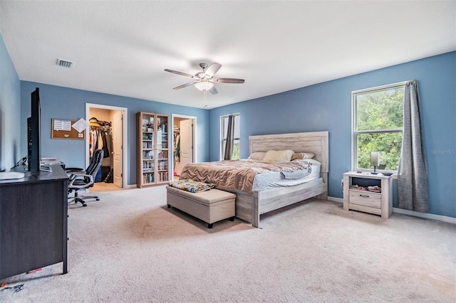 2073 Branding Iron Way, New Port Richey, FL 34655 - carpeted bedroom with a spacious closet, an office area, a ceiling fan, and a closet