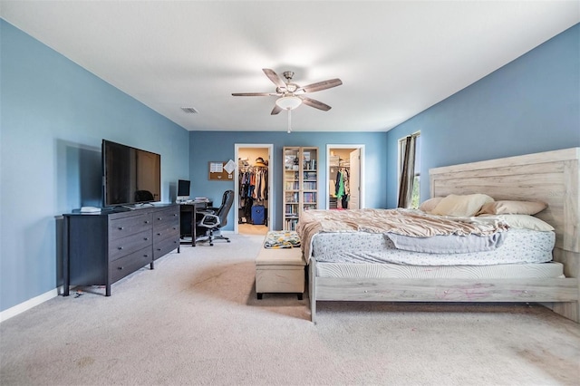 2073 Branding Iron Way, New Port Richey, FL 34655 - carpeted bedroom with a walk in closet, an office area, and a ceiling fan