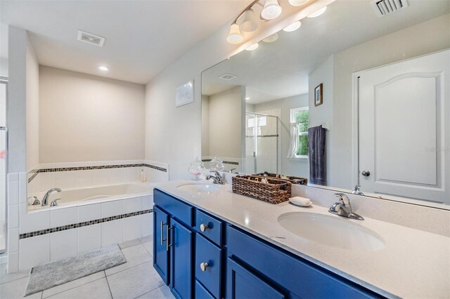 2073 Branding Iron Way, New Port Richey, FL 34655 - full bath featuring a bath, double vanity, a stall shower, and tile patterned flooring