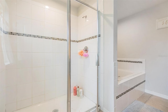 2073 Branding Iron Way, New Port Richey, FL 34655 - full bath with a garden tub, a shower stall, and tile patterned floors