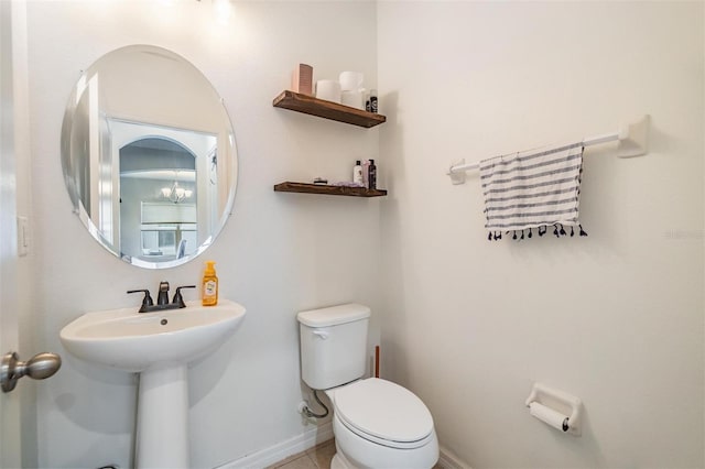 2073 Branding Iron Way, New Port Richey, FL 34655 - half bathroom featuring toilet and baseboards