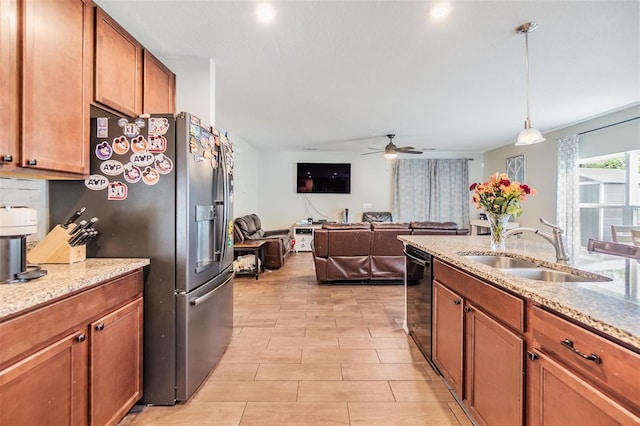 2073 Branding Iron Way, New Port Richey, FL 34655 - kitchen featuring black dishwasher, stainless steel fridge with ice dispenser, brown cabinetry, and a ceiling fan