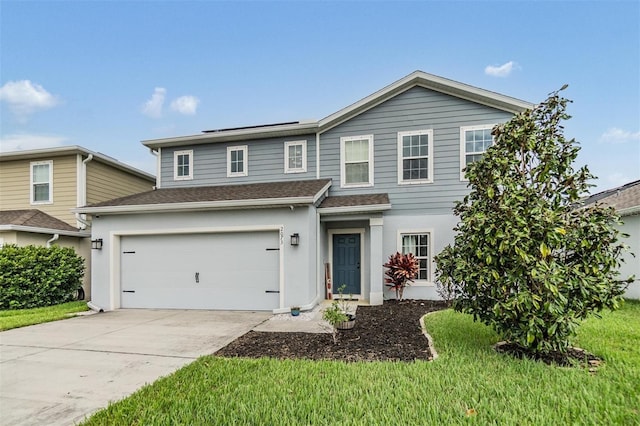 2073 Branding Iron Way, New Port Richey, FL 34655 - view of front of property with concrete driveway, stucco siding, a garage, solar panels, and a shingled roof
