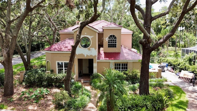 16006 Armistead Ln, Odessa, FL 33556 - mediterranean / spanish house with a tiled roof and stucco siding