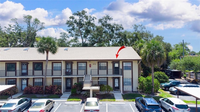 2400 Winding Creek Blvd Unit Bldg18A # 210, Clearwater, FL 33761 - view of property with uncovered parking