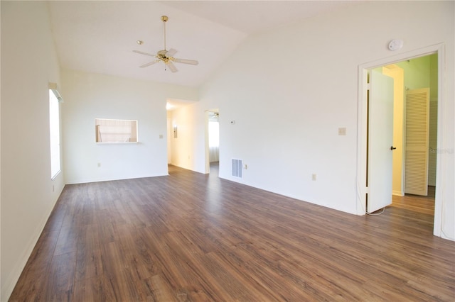 2400 Winding Creek Blvd Unit Bldg18A # 210, Clearwater, FL 33761 - unfurnished living room featuring a ceiling fan, vaulted ceiling, and dark wood-style flooring