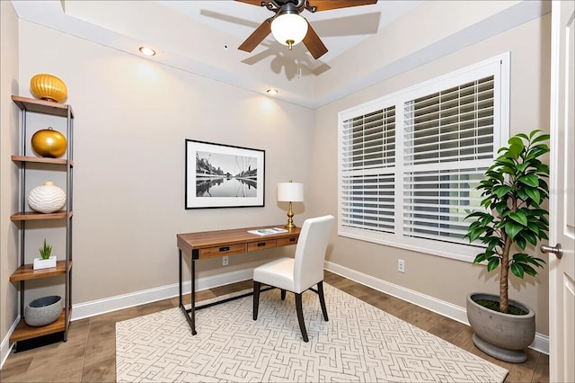 10520 Boardwalk Loop Unit 202, Bradenton, FL 34202 - home office featuring ceiling fan and a raised ceiling