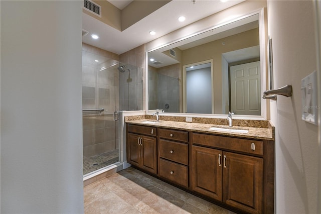 10520 Boardwalk Loop Unit 202, Bradenton, FL 34202 - full bathroom with tile patterned floors, a stall shower, double vanity, and recessed lighting