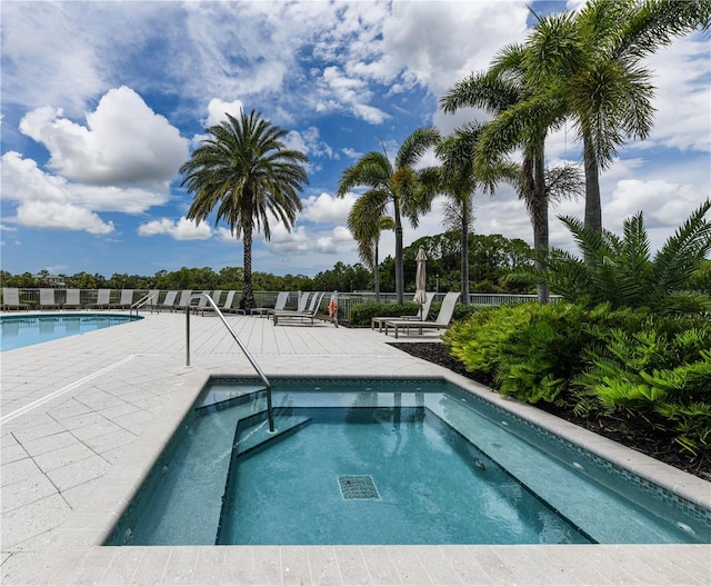 10520 Boardwalk Loop Unit 202, Bradenton, FL 34202 - community pool with a patio area