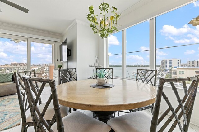 706 Bayway Blvd Unit 503, Clearwater, FL 33767 - dining area with ornamental molding and a chandelier