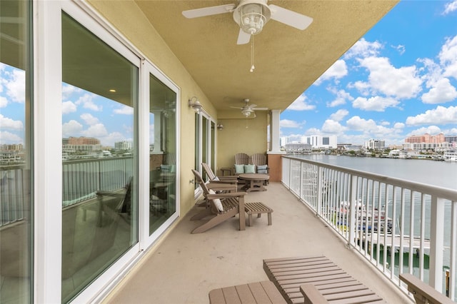 706 Bayway Blvd Unit 503, Clearwater, FL 33767 - balcony with a ceiling fan, a water view, and a city view