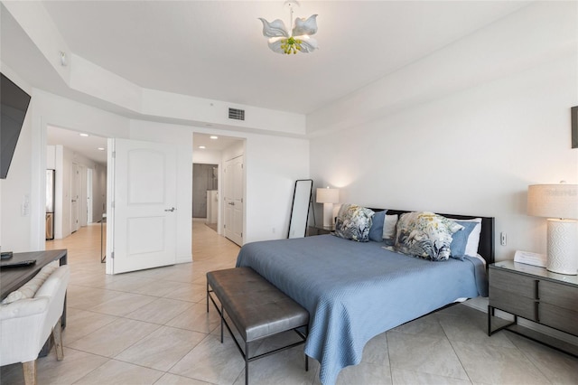 706 Bayway Blvd Unit 503, Clearwater, FL 33767 - bedroom with light tile patterned floors, recessed lighting, and connected bathroom