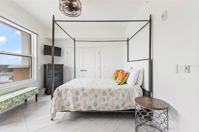 706 Bayway Blvd Unit 503, Clearwater, FL 33767 - bedroom featuring light tile patterned floors and a closet