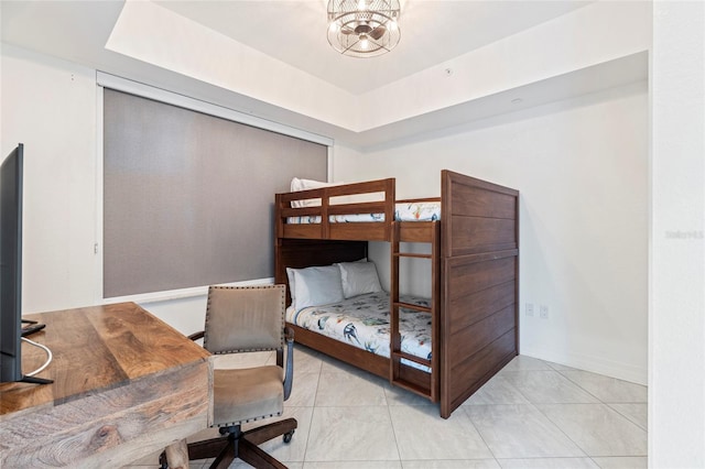 706 Bayway Blvd Unit 503, Clearwater, FL 33767 - bedroom featuring a raised ceiling, light tile patterned floors, an office area, and a chandelier