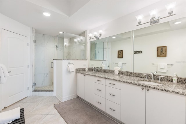 706 Bayway Blvd Unit 503, Clearwater, FL 33767 - bathroom with double vanity, a stall shower, and recessed lighting
