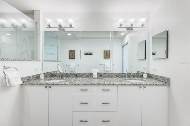 706 Bayway Blvd Unit 503, Clearwater, FL 33767 - bathroom with double vanity and a shower stall