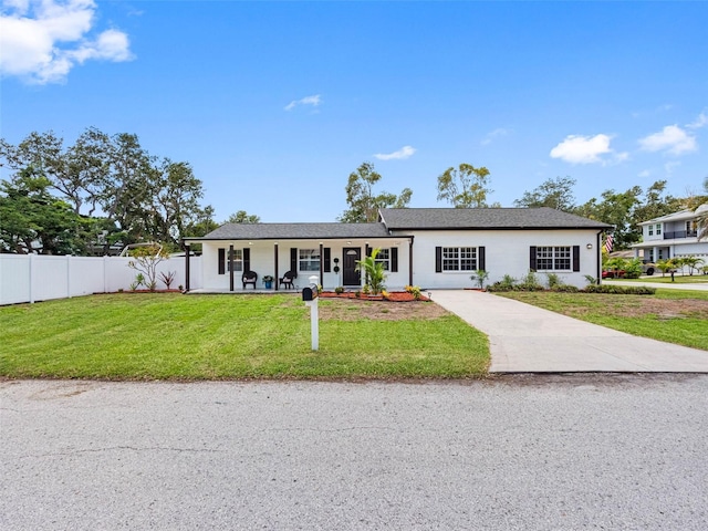 4401 S Trask St, Tampa, FL 33611 - ranch-style house with driveway, a porch, and stucco siding
