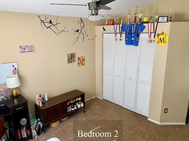 5139 Corvette Dr, Tampa, FL 33624 - recreation room with carpet, a ceiling fan, and a textured ceiling