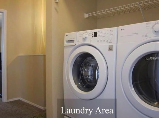 5139 Corvette Dr, Tampa, FL 33624 - washroom featuring washer and clothes dryer and carpet floors