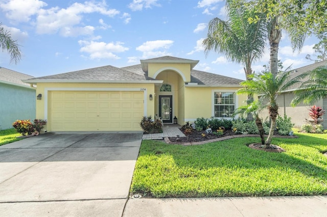 13194 Royal Pines Ave, Riverview, FL 33579 - ranch-style house featuring stucco siding, a garage, a front lawn, driveway, and roof with shingles