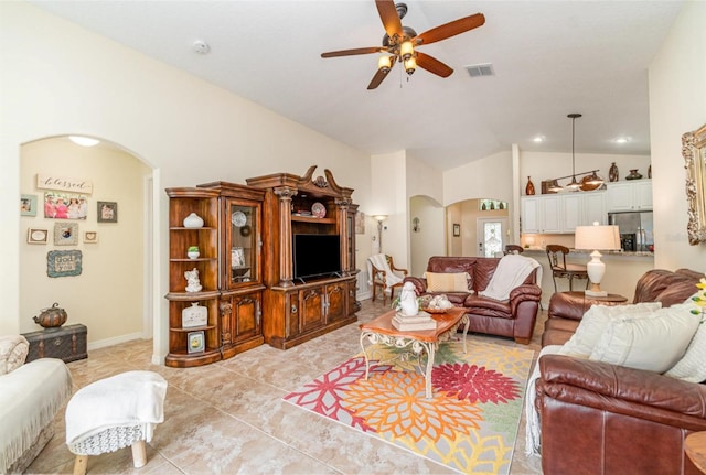 13194 Royal Pines Ave, Riverview, FL 33579 - living room with arched walkways, ceiling fan, lofted ceiling, and light tile patterned floors