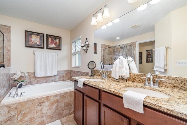 13194 Royal Pines Ave, Riverview, FL 33579 - bathroom with a stall shower, a bath, and double vanity