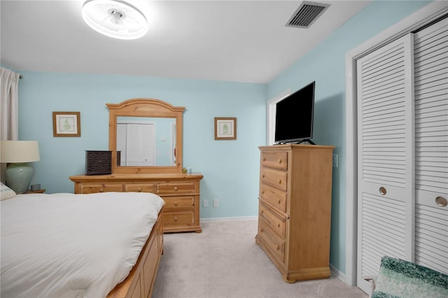 1701 Pinehurst Rd Unit 33E, Dunedin, FL 34698 - bedroom with light carpet and a closet