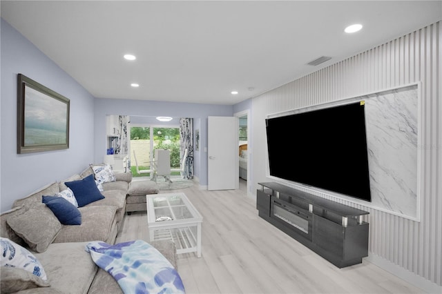 1701 Pinehurst Rd Unit 33E, Dunedin, FL 34698 - living area with recessed lighting, wood finished floors, and an accent wall