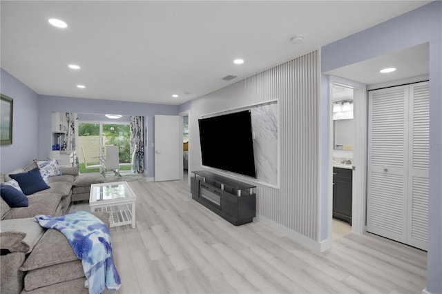 1701 Pinehurst Rd Unit 33E, Dunedin, FL 34698 - living room with light wood finished floors and recessed lighting